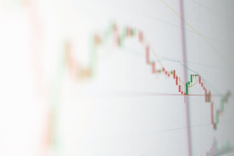 Professional workspace with MacBook and notebooks